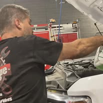 Rescue Wrench LLC diesel technician working on emergency apparatus