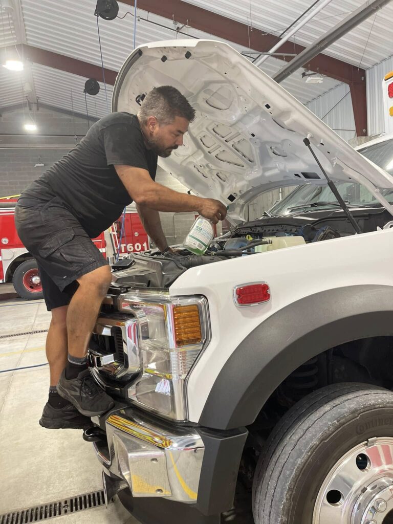 Rescue Wrench LLC diesel technician working on emergency apparatus